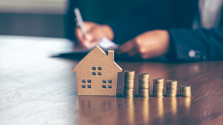 house with piles of coins