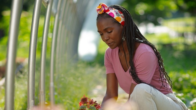 Jamila Norman picking flowers