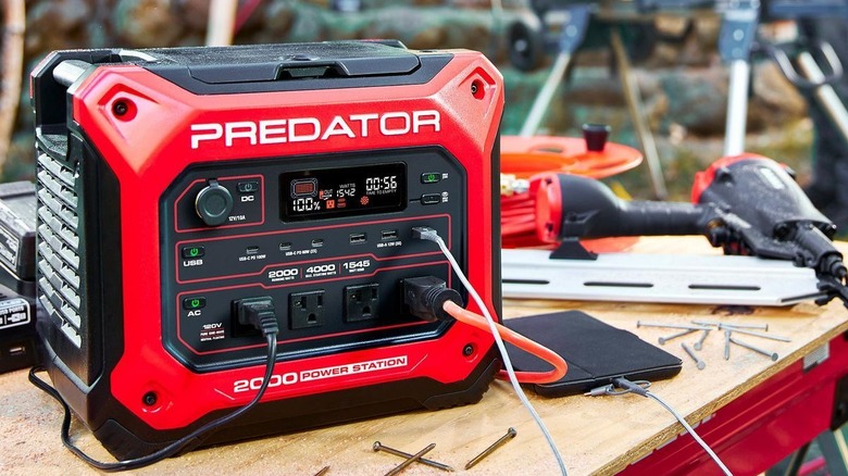 Predator Power Station sitting on a workbench next to nails and a drill