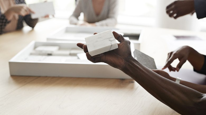 Someone holding a marble sample