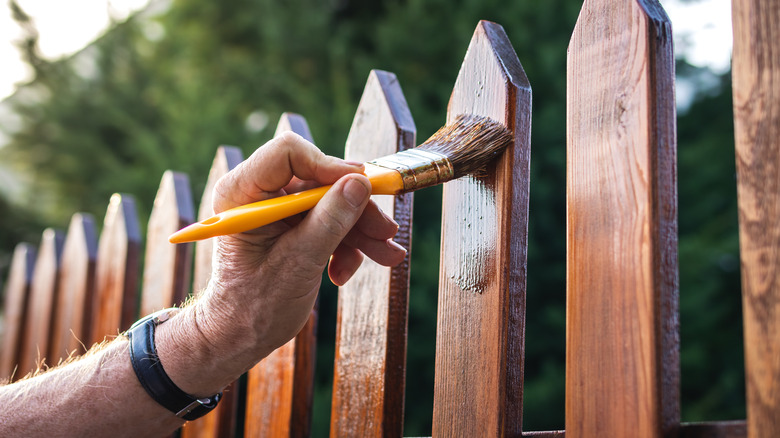 Staining vertical picket fence