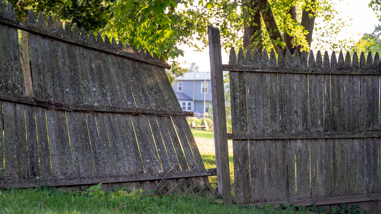 Stockade-style fence damaged in storm