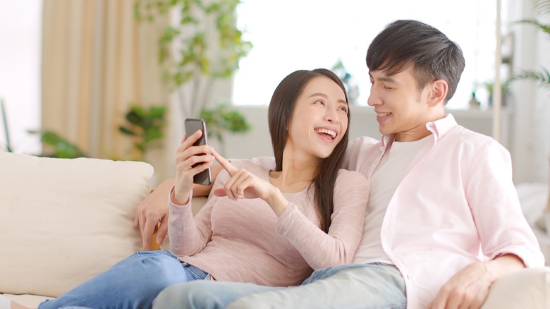 Couple looking at phone together