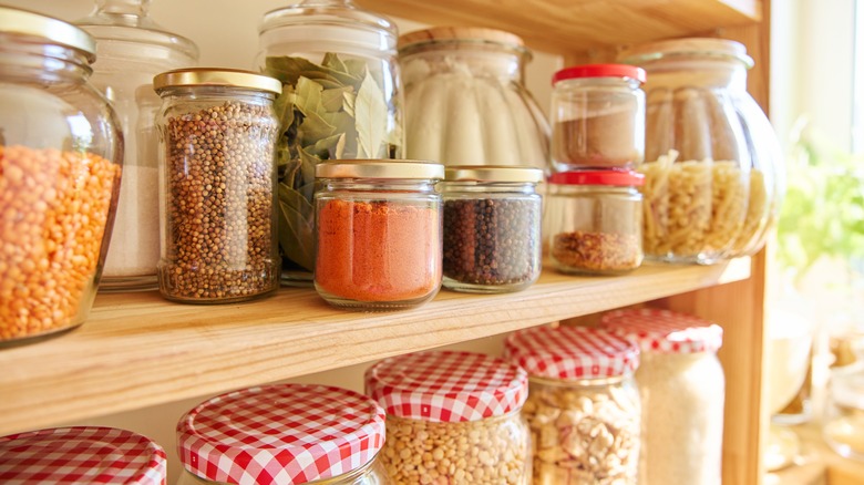 glass pantry jars with ingredients 