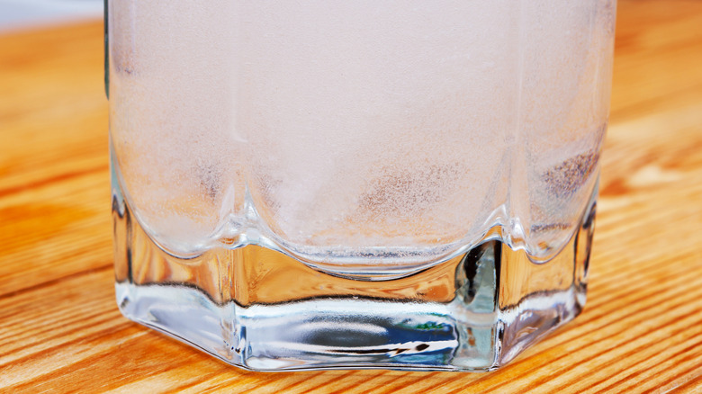 Alka-Seltzer bubbling in glass