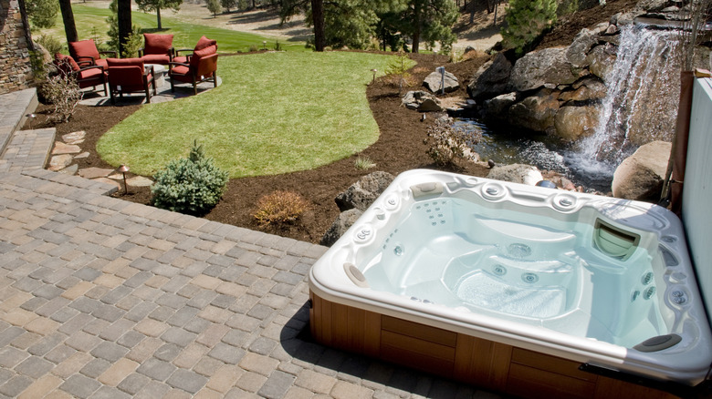 A hot tub in a backyard