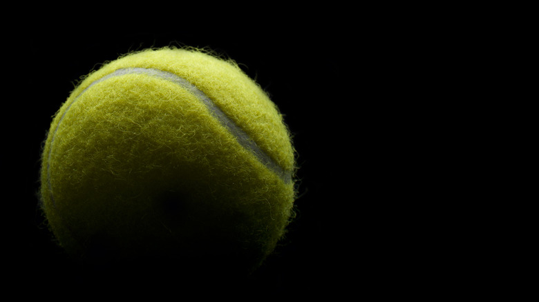 tennis ball black background