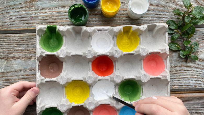 Egg carton with colorful paints