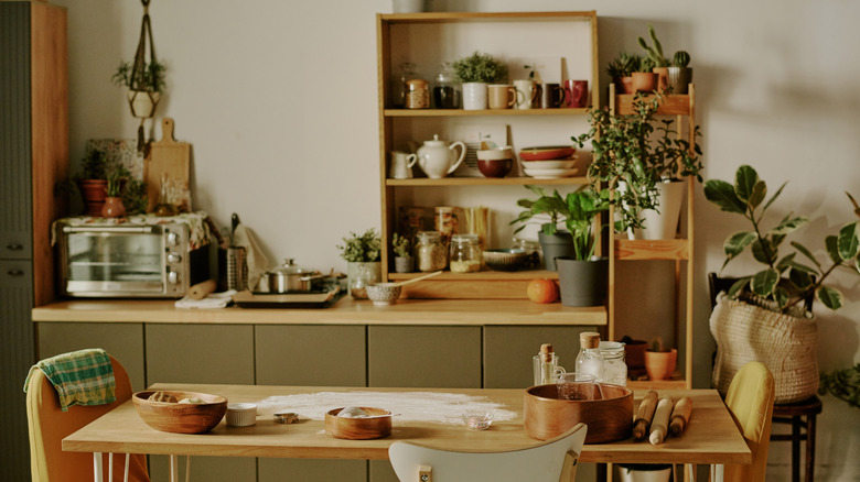 Kitchen with clutter on table and countertops