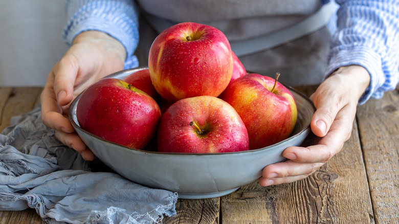 Washed red apples in bowl