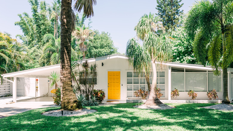 white home with yellow door