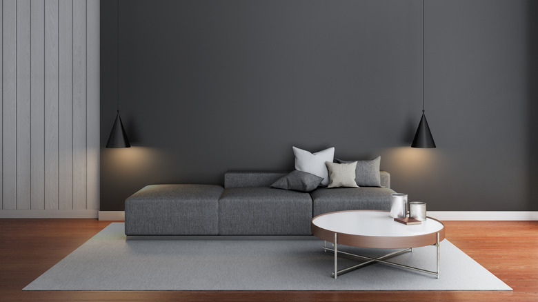 gray wall and gray sofa