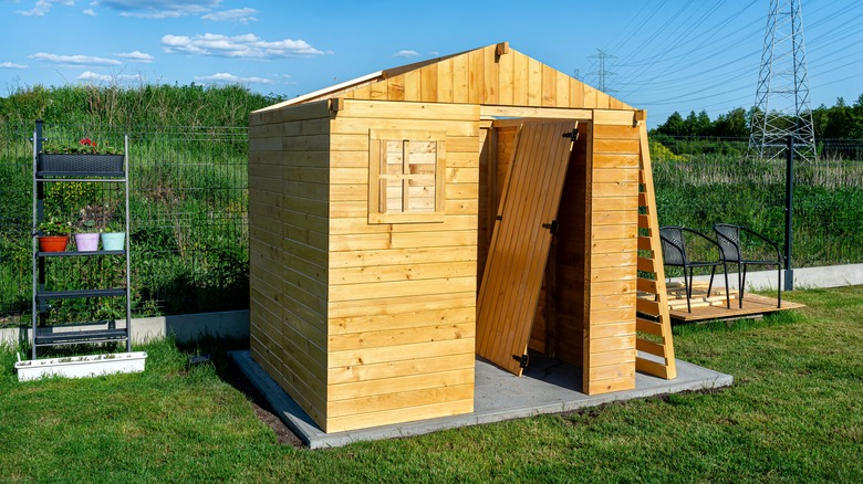 Half-built shed on concrete pad