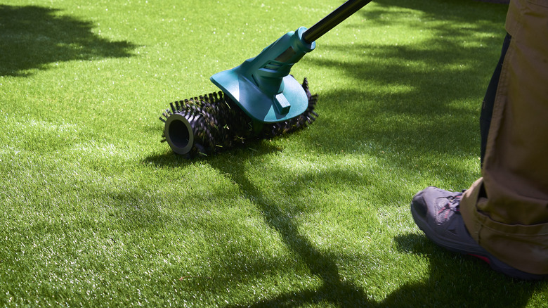 Synthetic brush on turf