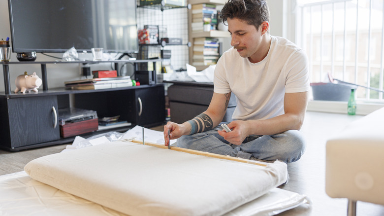 Man assembling a sofa