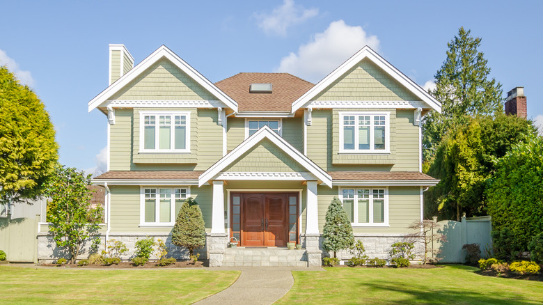 Green house with symmetrical windows