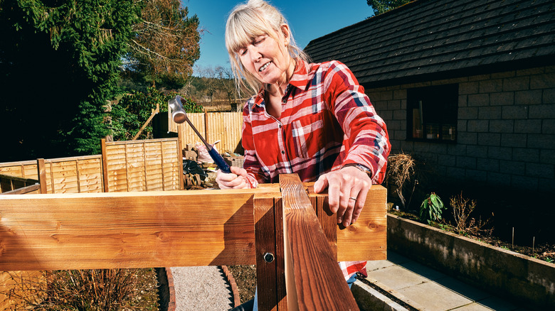 Woman assembling a gazebo kit