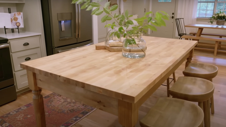 farmhouse table with wooden chairs