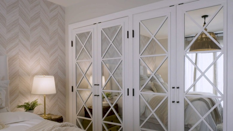 Mirrored bedroom closet doors with cross trim in