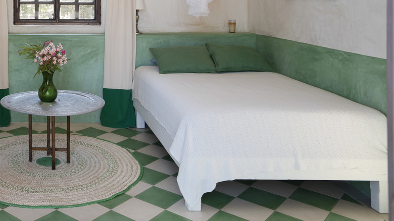 Bedroom with green and cream checkerboard tile floor