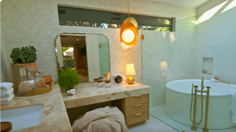 Bathroom with stucco tiled walls