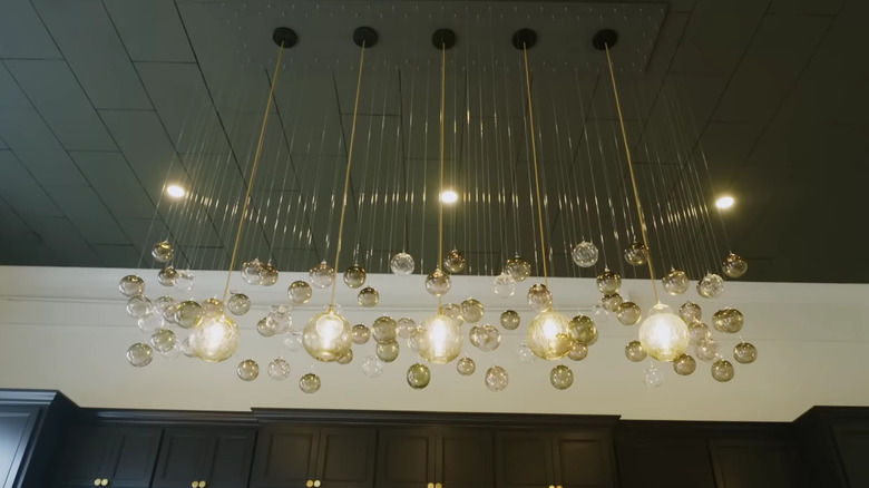 Gold sculptural lighting fixture in the kitchen