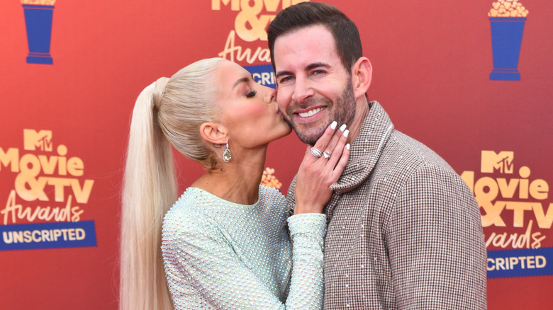 Heather kissing Tarek el Moussa