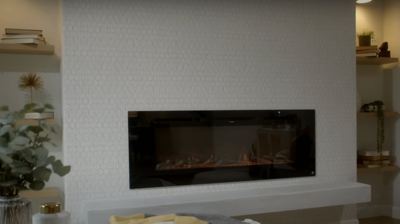 modern fireplace with textured wallpaper