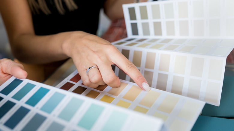 woman choosing paint colors