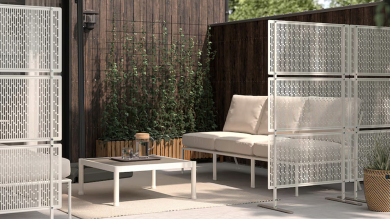 IKEA's LUNGON Privacy Screens on a patio with plants and aesthetically pleasing seating.