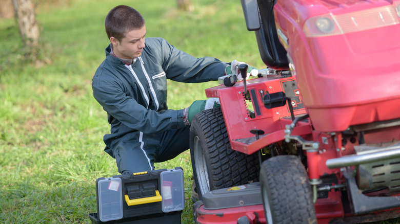 Man repairing mower