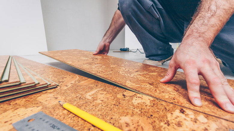 Man laying cork tiles