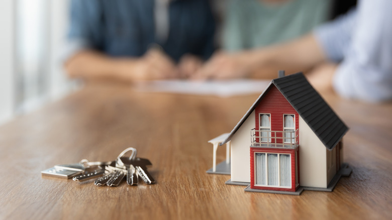 House and keys on table