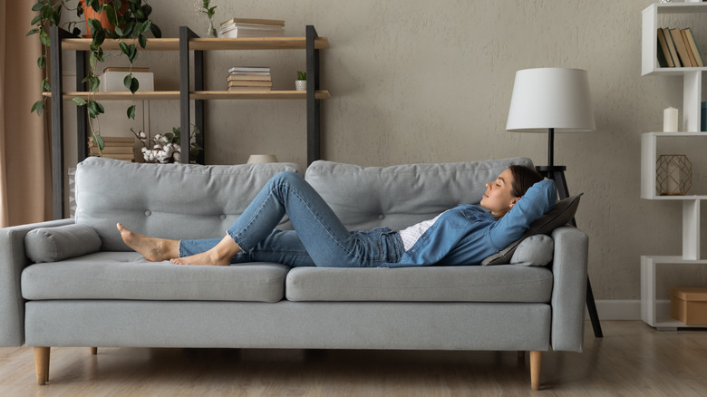 woman relaxing on couch