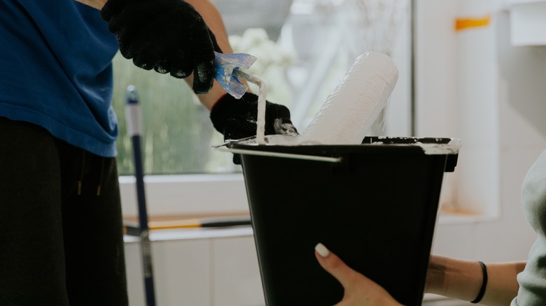 Scraping paint off a roller