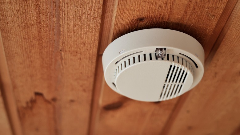 Smoke alarm on wood ceiling