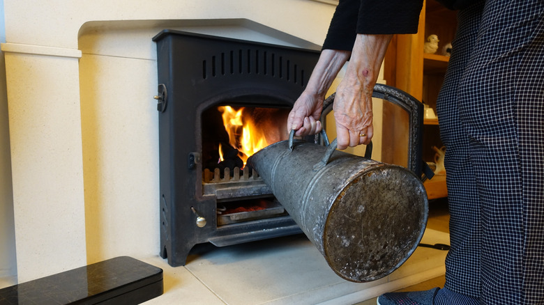 Introducing charcoal into fireplace