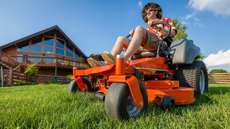 Person mowing lawn