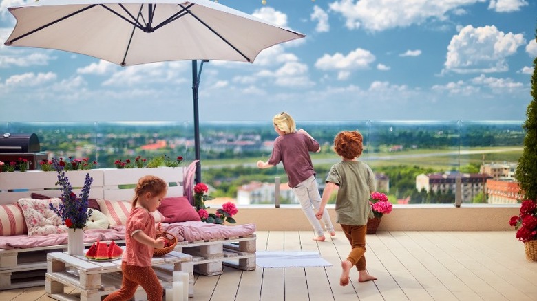 Children playing on a deck