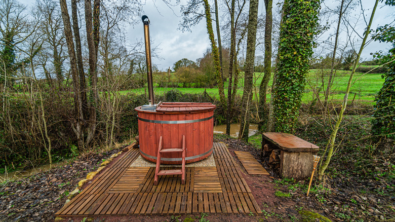 wooden hot tub in forest