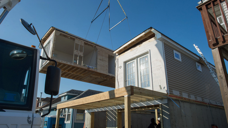 modular houses being moved