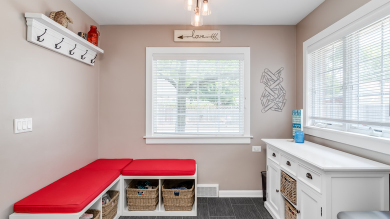 large mudroom with red cushions