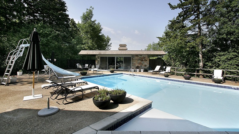 pool house with rock facade