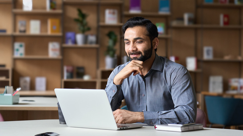 Man sitting with laptop