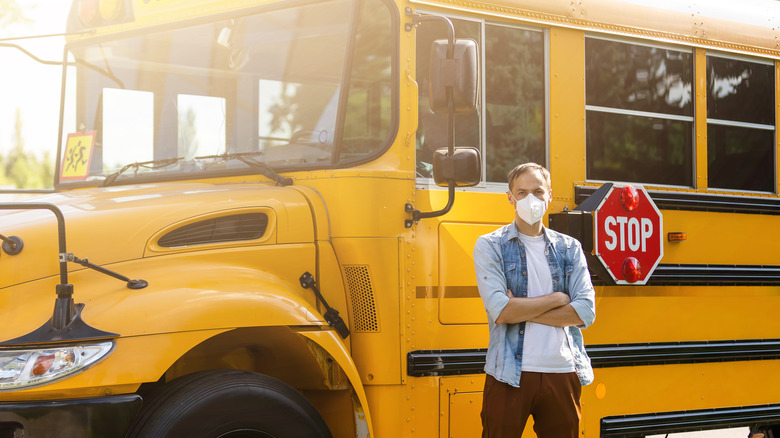 man with school bus