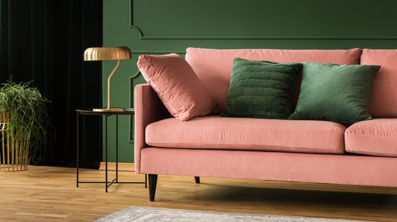 Pink sofa in green room