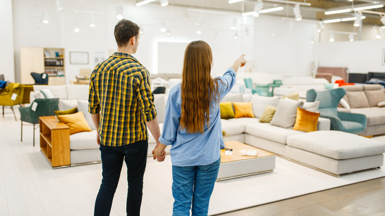 Couple shopping in furniture store