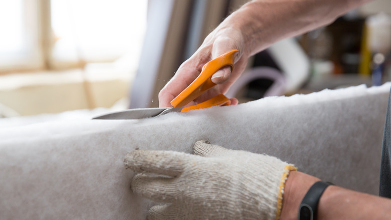 Scissors cutting furniture batting