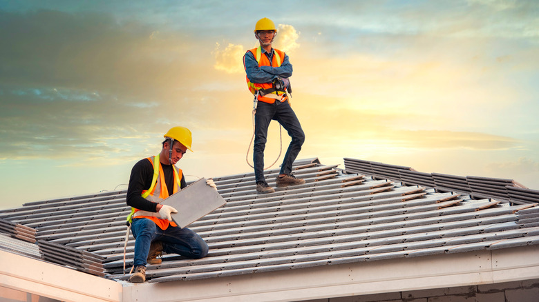 workers installing roof