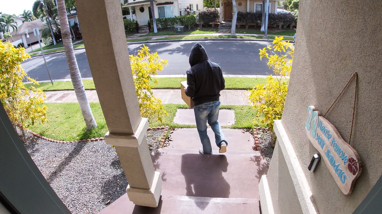 thief running from porch